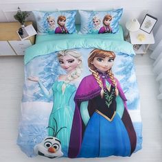 a bed with two frozen princesses on it and one has an image of the same character