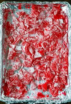 red and white ice cubes in a square glass dish