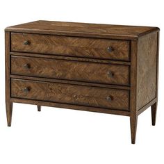 a wooden dresser with three drawers on it