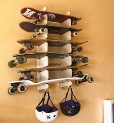 there is a skateboard hanging on the wall with other skateboards attached to it