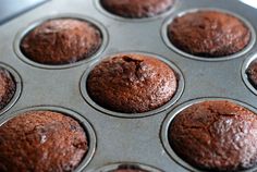 chocolate muffins in a metal pan ready to be baked into the oven for consumption