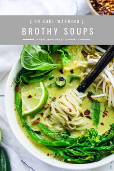 a bowl of broccoli soup with noodles and garnishes