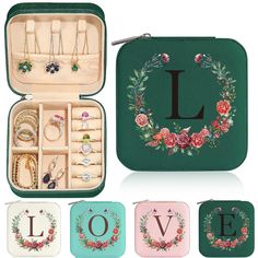 an assortment of jewelry and rings in a green case with the letter l on it