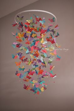 a chandelier with many colorful butterflies hanging from it