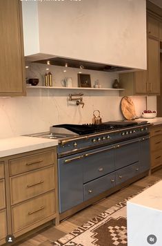 a kitchen with an oven, sink and counter tops in it's center island