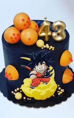 a birthday cake decorated with an image of gohan and the number forty five surrounded by oranges