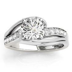 a white gold engagement ring with diamonds on it