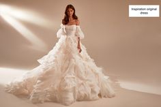 a woman in a white wedding dress with ruffled skirt and off the shoulder sleeves