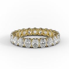 a yellow gold and white diamond ring with rows of round diamonds on the side, set in