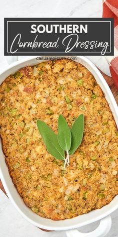 southern cornbread dressing in a white casserole dish with a green leaf on top