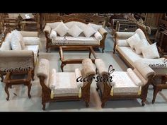 an assortment of couches and chairs in a store