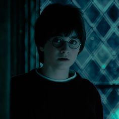 harry potter in glasses looking at the camera