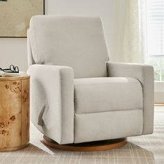 a living room with a chair and side table