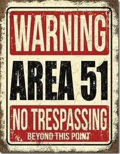 a sign that says warning area 51 no trespassing beyond this point