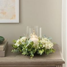 a candle and some flowers on a table