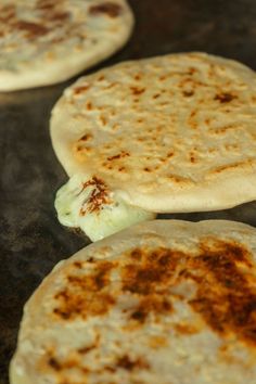 three pita breads sitting on top of a counter