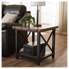 a living room with a couch, chair and end table