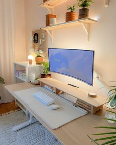 a computer desk with a monitor and keyboard on it