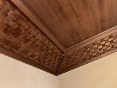 the ceiling is made out of wood and has many squares on it