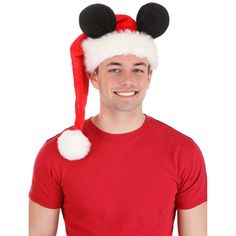 Embrace the magic of the holiday season with a whimsical twist! Presenting the Disney Mickey Santa Cap, exclusively made by us, where iconic charm meets festive flair. With 66% acrylic and 34% polyester faux fur, this cap ensures warmth during those chilly winter celebrations. The sculpted velour outer shell, complemented by a plush faux fur band and a playful pompom tip, adds a dash of enchantment to your holiday ensemble.Beyond its delightful appearance, this cap boasts remarkable functionalit Santa Cap, Disney Hats, Hats Black, Faux Fur Material, Holiday Costumes, Baby Boy Accessories, Disney Boys, Costume Themes, Mickey Mouse Ears