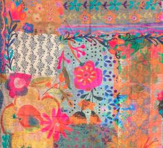 an old patchwork quilt with colorful flowers and leaves on the front, in multicolors