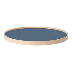 a round blue table top on a white background with an oval wooden tray in the middle