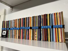 there are many books lined up on the shelf in front of each other and numbered with numbers