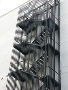 a tall building with lots of metal bars on it