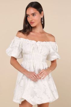 Get ready to be the sweetest babe at the party in the Lulus Adorable Crush Ivory Jacquard Off-the-Shoulder Mini Dress! Lightweight woven jacquard, with a floral design throughout, shapes this darling dress. Short puff sleeves (with elastic at the cuffs and decorative bows at the shoulder) frame an off-the-shoulder neckline with ruffle trim and an adjustable, elasticized drawstring that forms a playful matching bow at the center. Gathered bust tops a high, banded waist. Skirt has a flirty bubble Cream Off-shoulder Party Dress, Cream Off-shoulder Mini Dress, Feminine White Off Shoulder Dress For Party, Cream Puff Sleeve Mini Dress For Party, Off-shoulder Cream Mini Dress For Brunch, White Off Shoulder Dress With Short Sleeves For Party, Cream Off-shoulder Mini Dress For Brunch, White Off Shoulder Short Sleeve Party Dress, Cream Off-shoulder Dress For Brunch