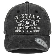 the vintage aged to perfection hat in black with white lettering and stars on the front