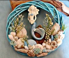 a wreath with shells and seahorses on it