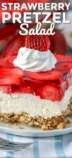 strawberry pretzel salad on a white plate with strawberries