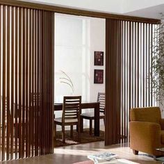 a living room filled with furniture and wooden slats