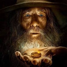 an old wizard holding a gold coin in his hands