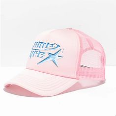 a pink trucker hat with blue stars on the front and white mesh around the brim