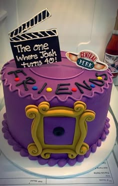 a birthday cake with the name it's eleven on top and an image of a movie clapper