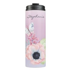 thermos flask is decorated with pink flowers and butterflies, while an image of a butterfly sits on top