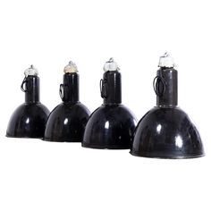 three black lamps sitting next to each other