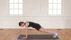 a woman is doing an exercise on a yoga mat