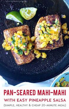 pan - seared mahi - mahi with easy pineapple salsa on a black plate