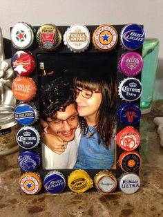 a couple kissing in front of a bottle cap frame with the caption's name on it