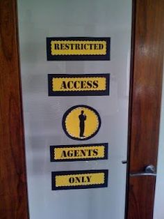 the door to an office has stickers on it that say restricted, access, and only