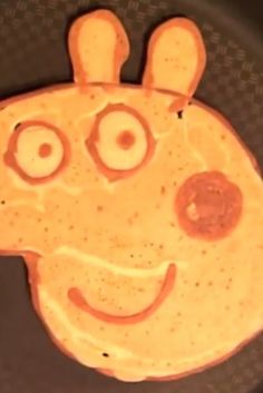 a pancake shaped like a giraffe with googly eyes