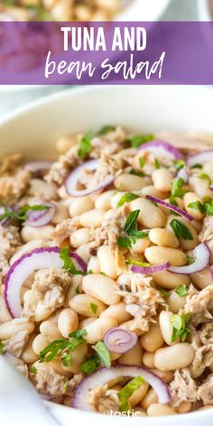 tuna and bean salad in a white bowl with red onions, cilantro and parsley