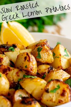 a white bowl filled with cooked greek lemon potatoes