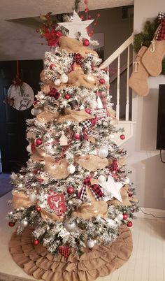 a christmas tree decorated with burlocks and ornaments