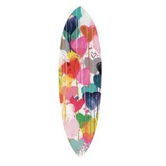 a colorful surfboard with hearts painted on it