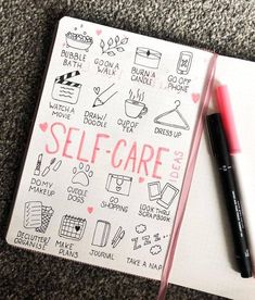 a notepad with writing on it and a pen next to it that says self - care