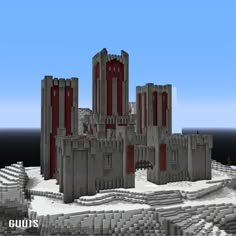 a very large castle sitting on top of a snow covered hill