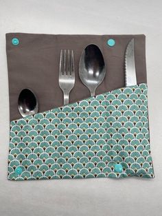 a place mat with spoons and forks on it